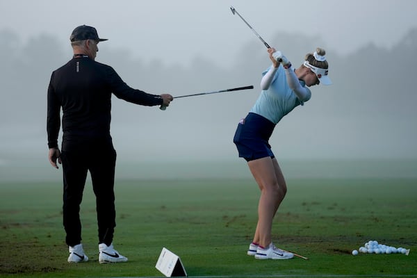 FILE - Instructor Jamie Mulligan works with Nelly Korda on the driving range prior to the second round of the Chevron Championship LPGA golf tournament Friday, April 19, 2024, at The Club at Carlton Woods, in The Woodlands, Texas. (AP Photo/David J. Phillip, File)