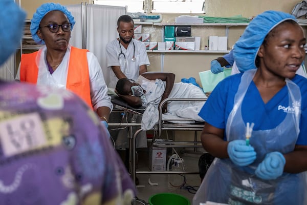 People wounded in the fighting between M23 rebels and Congolese armed forces arrive at the Cbeca Ndosho hospital in Goma, Democratic Republic of the Congo, Thursday, Jan. 23, 2025. (AP Photo/Moses Sawasawa)