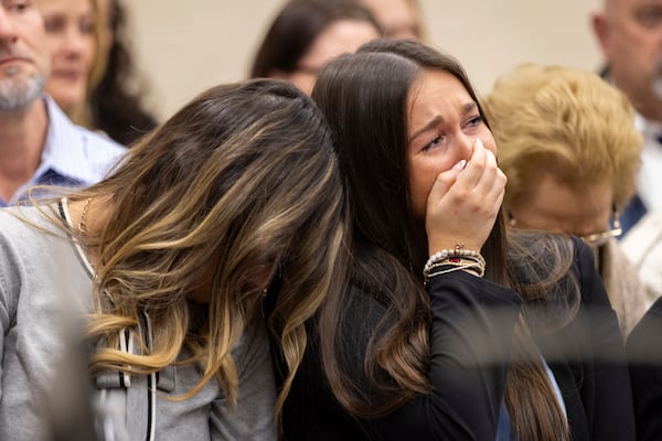 From left, Connolly Huth, roommate of Laken Riley, and Lauren Phillips, Riley's younger sister, become emotional during the trial for Jose Ibarra at the Athens-Clarke County Superior Court on Tuesday, Nov. 19, 2024, in Athens, Ga. (Arvin Temkar/Atlanta Journal-Constitution via AP, Pool)