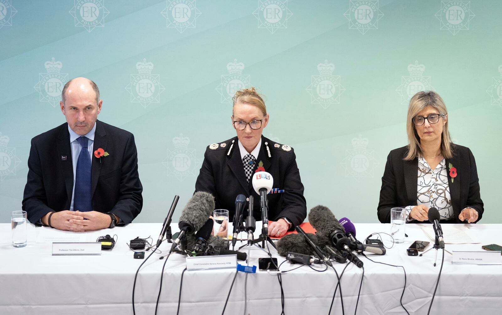 Professor Tim Atkins, Merseyside Police Chief Constable Serena Kennedy, and Dr Renu Bindra meet the press at Merseyside Police Headquarters, Liverpool, England, Tuesday, Oct. 29, 2024. Axel Rudakubana, 18, the teenager accused in a stabbing rampage that killed three girls at a Taylor Swift-themed dance class in England has been charged with producing the deadly poison ricin and faces a terror offense. (Danny Lawson/PA via AP)