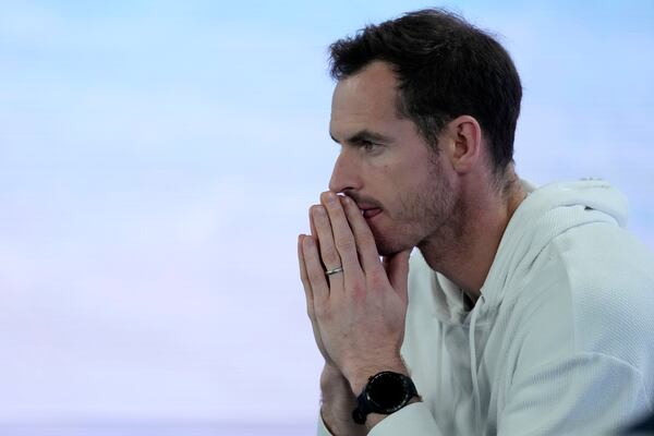 Andy Murray watches Novak Djokovic of Serbia during his quarterfinal match against Carlos Alcaraz of Spain at the Australian Open tennis championship in Melbourne, Australia, Tuesday, Jan. 21, 2025. (AP Photo/Asanka Brendon Ratnayake)