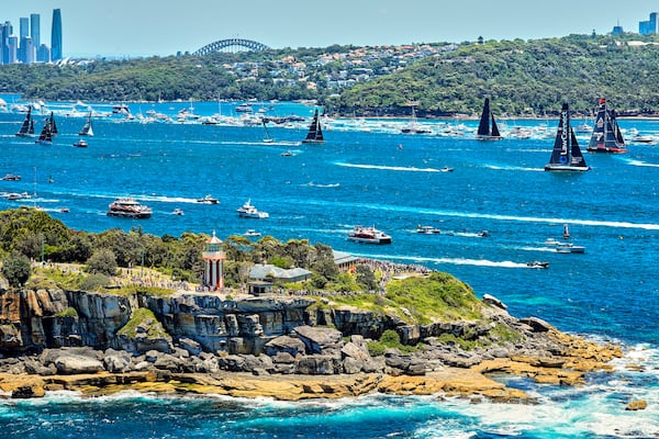 In this photo provided by Rolex, competitors sail towards the heads as they leave Sydney Harbour at the start of the Sydney to Hobart yacht race in Sydney, Thursday, Dec. 26, 2024. (Carlo Borlenghi/Rolex via AP)