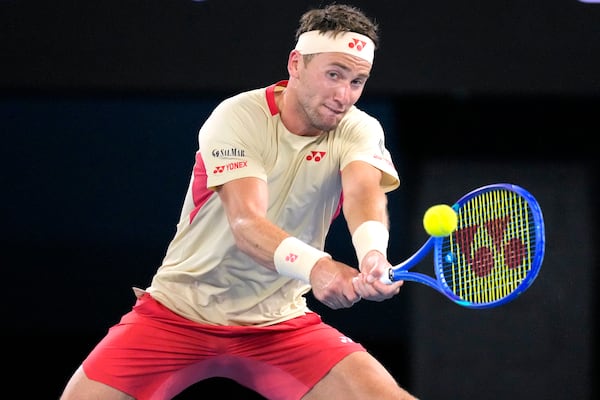 Casper Ruud of Norway plays a backhand return to Jaume Munar of Spain during their first round match at the Australian Open tennis championship in Melbourne, Australia, Sunday, Jan. 12, 2025. (AP Photo/Vincent Thian)