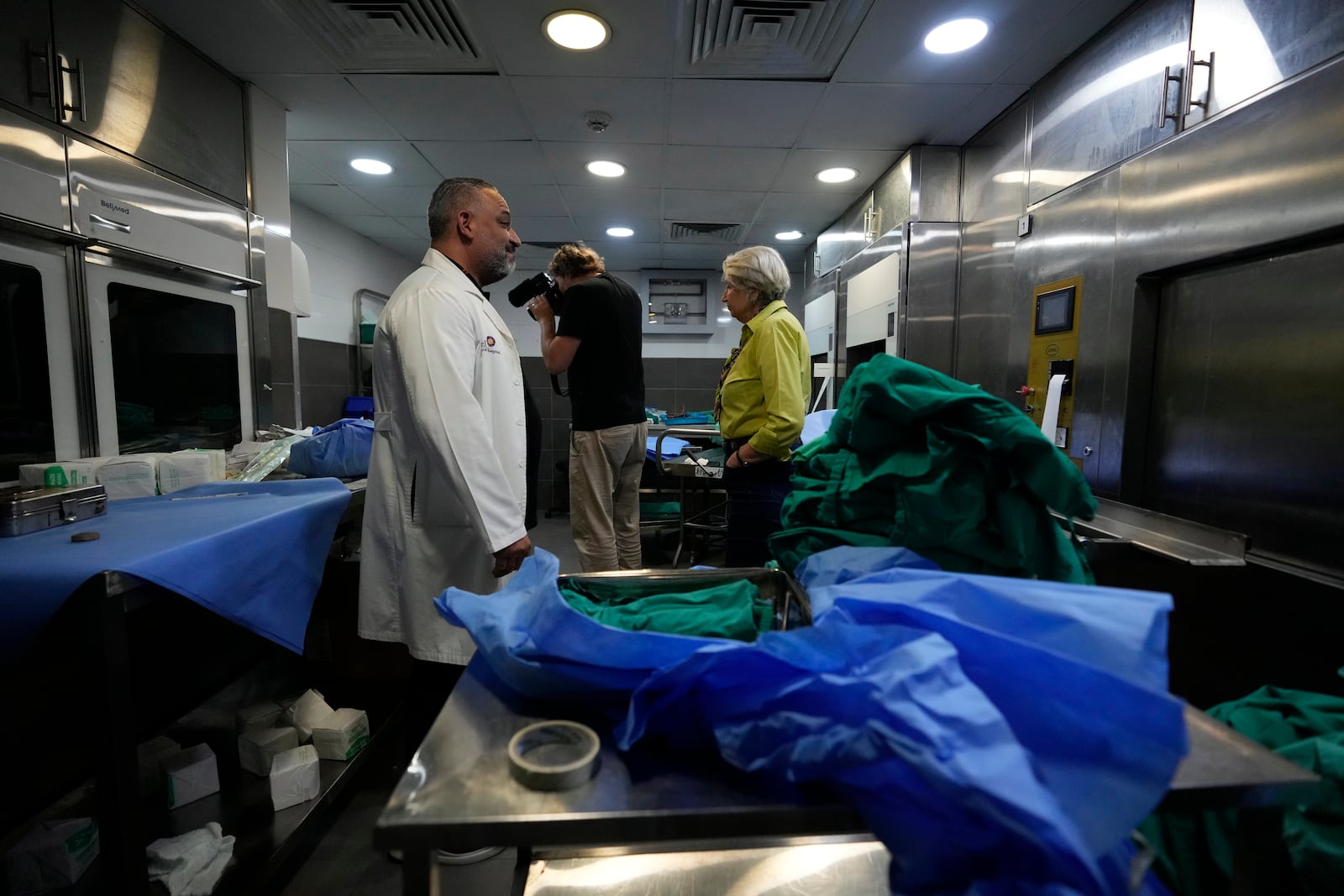 Journalists take a tour inside Sahel General Hospital, in Dahiyeh, Beirut, Lebanon, Tuesday, Oct. 22, 2024, a day after the Israeli army said that Hezbollah is storing hundreds of millions of dollars in cash and gold under the hospital. (AP Photo/Hassan Ammar)