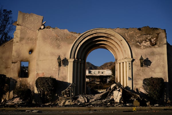 The facade of the Altadena Community Church stands amidst damage from the Eaton Fire on Monday, Jan. 13, 2025, in Altadena, Calif. (AP Photo/Carolyn Kaster)