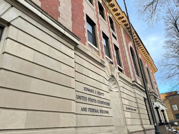 The Edward J. Devitt U.S. Courthouse and Federal building is seen, where two men on trial face human smuggling charges, Monday, Nov. 18, 2024, in Fergus Falls, Minn. (AP Photo/Michael Goldberg)