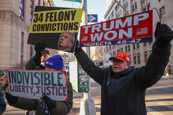 Demonstrators protest outside Manhattan criminal court before the start of the sentencing in President-elect Donald Trump's hush money case, Friday, Jan. 10, 2025, in New York. (AP Photo/Yuki Iwamura)