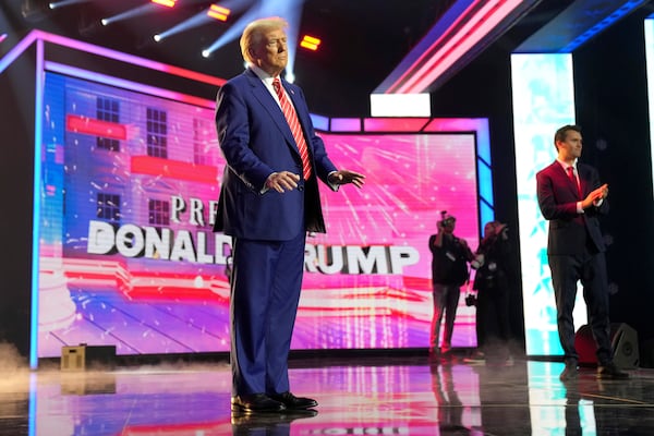 President-elect Donald Trump arrives to speak at AmericaFest, Sunday, Dec. 22, 2024, in Phoenix. (AP Photo/Rick Scuteri)