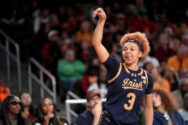 Notre Dame guard Hannah Hidalgo (3) reacts after making a shot during the first half of an NCAA college basketball game against Southern California, Saturday, Nov. 23, 2024 in Los Angeles. (AP Photo/Eric Thayer)