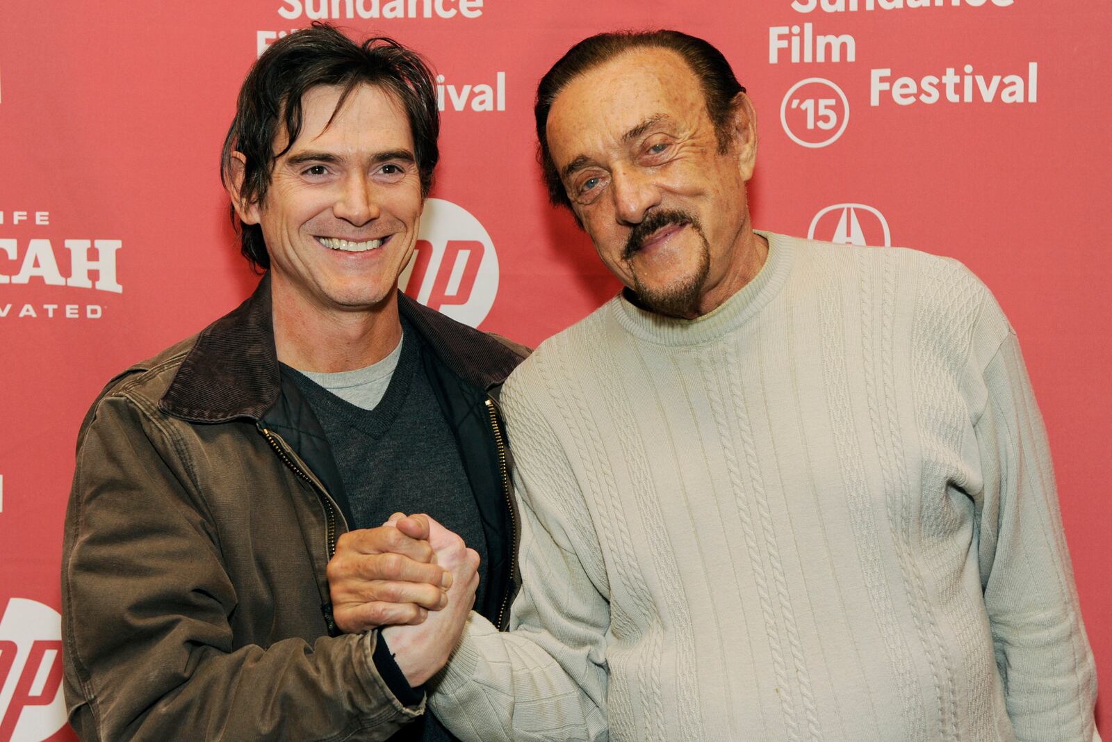 FILE - Billy Crudup, left, who portrays Stanford professor Dr. Philip Zimbardo in "Stanford Prison Experiment," poses with Zimbardo at the premiere of the film at the Eccles Theatre during the 2015 Sundance Film Festival on Monday, Jan. 26, 2015, in Park City, Utah. (Photo by Chris Pizzello/Invision/AP, File)