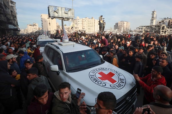 A Red Cross convoy arrives to collect Israeli hostages released after a ceasefire agreement between Israel and Hamas took effect, in Gaza City Sunday, Jan. 19, 2025. (AP Photo/Abed Hajjar)