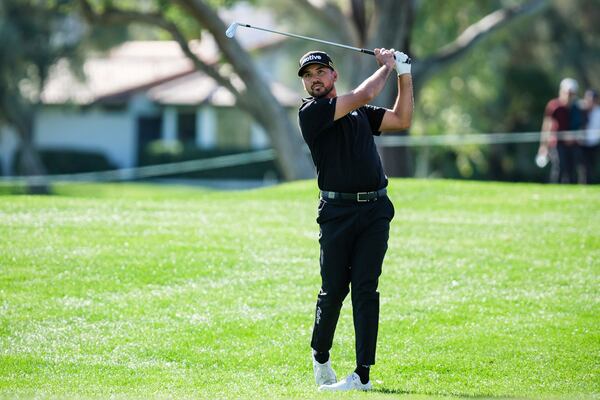 Jason Day hits from the fifth fairway at La Quinta Country Club Course during the first round of the American Express golf tournament in La Quinta, Calif., Thursday, Jan. 16, 2025. (AP Photo/William Liang)