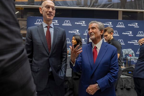 NBA Commissioner Adam Silver, left, and Ted Leonsis, owner of the Washington Wizards NBA basketball team and Washington Capitals NHL hockey team, attend an event announcing a new Capital One Arena Gallery Place Atrium, Thursday, Dec. 19, 2024, in Washington. (AP Photo/Jacquelyn Martin)