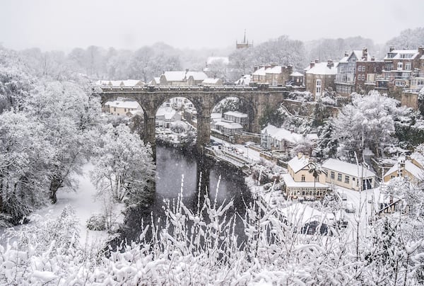 Snow covers houses and the 'Knaresborough Viaduct' in Knaresborough, England, Sunday, Jan. 5, 2025. (Danny Lawson/PA via AP)