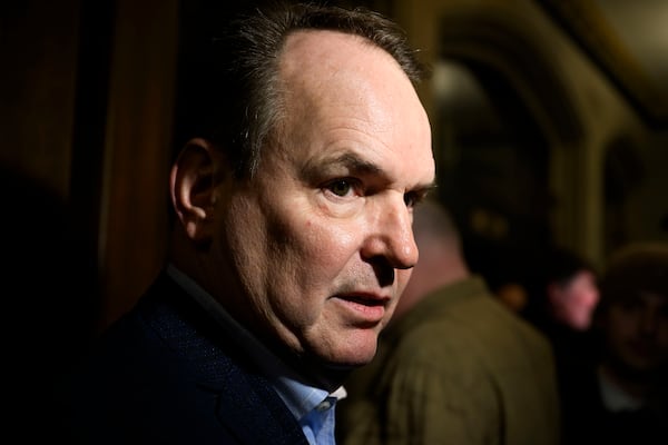 Minister of Employment, Workforce Development and Labour Steven MacKinnon speaks with journalists on his way to a Liberal Party caucus meeting in West Block on Parliament Hill, in Ottawa, Wednesday, Jan. 8, 2025. (Justin Tang/The Canadian Press via AP)