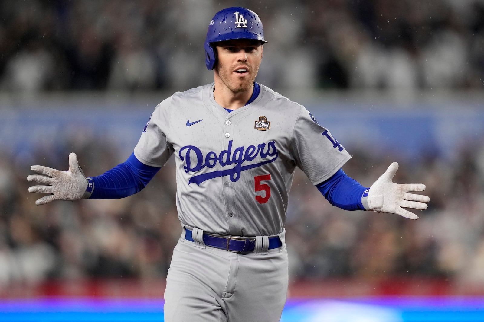 Los Angeles Dodgers' Freddie Freeman celebrates his two-run home run against the New York Yankees during the first inning in Game 4 of the baseball World Series, Tuesday, Oct. 29, 2024, in New York. (AP Photo/Ashley Landis)