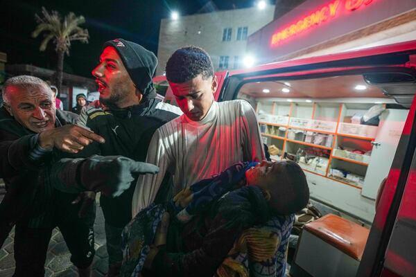 The body of 8-year-old Adam Farajallah is brought to Al-Aqsa Martyrs Hospital following an airstrike on a house in the Bureij refugee camp, in the central Gaza Strip town of Deir al-Balah, Wednesday, Jan. 1, 2025. (AP Photo/Abdel Kareem Hana)