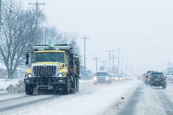 A city of Walker plow removes snow from Lake Michigan Drive in Walker, Mich., Friday, Jan. 10, 2025. (Joel Bissell/Kalamazoo Gazette via AP)