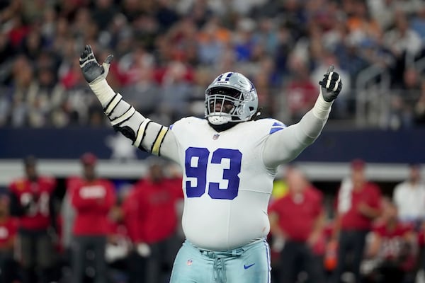 Dallas Cowboys defensive tackle Linval Joseph celebrates a sack of Tampa Bay Buccaneers quarterback Baker Mayfield in the second half of an NFL football game in Arlington, Texas, Sunday, Dec. 22, 2024. (AP Photo/Jeffrey McWhorter)