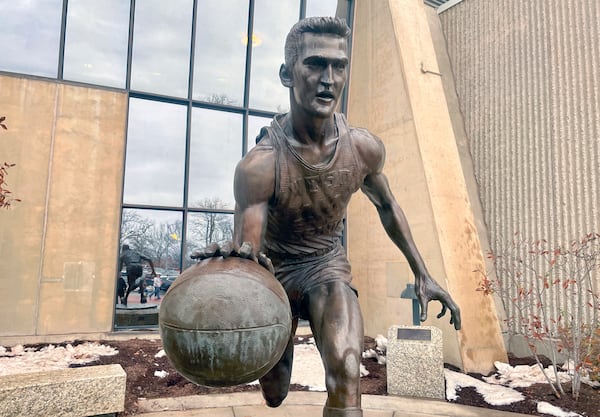 A statue honoring NBA great Jerry West, stands outside the West Virginia University Coliseum, in Morgantown, W.Va., Saturday, Jan. 18, 2025, as fans arrive for an NCAA college basketball game between Iowa State and West Virginia. (AP Photo/John Raby)