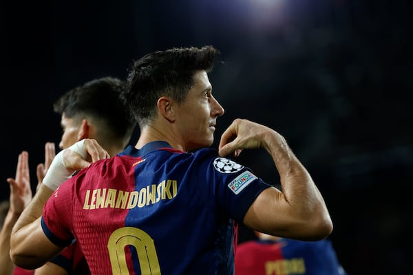 Barcelona's Robert Lewandowski celebrates after scoring his team's first goal during a Champions League phase soccer Matchday 5 between Barcelona and Brest at the Lluis Companys Olympic Stadium in Barcelona, Spain, Tuesday, Nov. 26, 2024. (AP Photo/Joan Monfort)