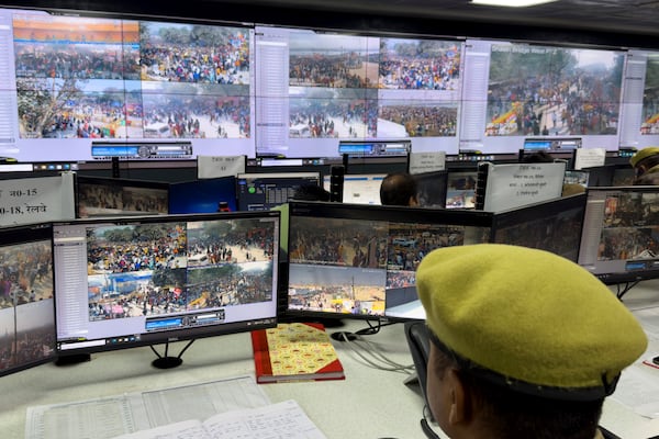 A police official monitors the movements of the people at the control room after a stampede when Hindu devotees rushed to take a holy bath in the Sangam, the confluence of the Ganges, the Yamuna and the mythical Saraswati rivers, on "Mauni Amavasya" or new moon day during the Maha Kumbh festival in Prayagraj, India, Wednesday, Jan. 29, 2025. (AP Photo/Rajesh Kumar Singh)