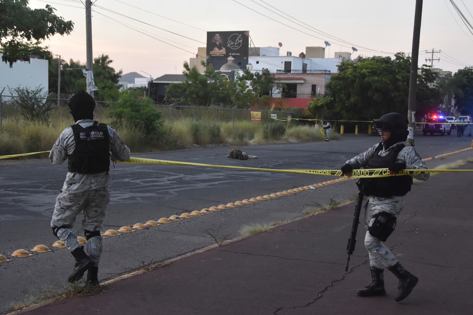 National Guards cordon off an area where a corpse lies on a street in Culiacan, Sinaloa state, Mexico, Monday, Oct. 14, 2024. (AP Photo)