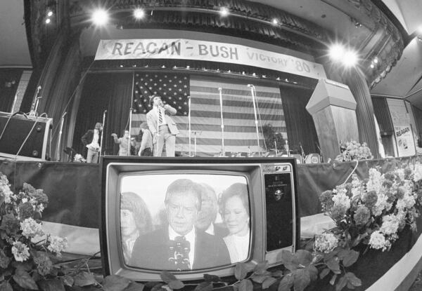 FILE - President Jimmy Carter on television at the Reagan-Bush team's headquarters, the Century Plaza Hotel, in Los Angeles, Nov. 5, 1980, as he concedes defeat to Ronald Reagan in the presidential election. (AP Photo, File)