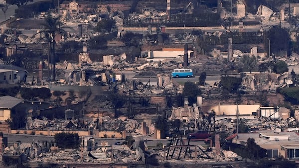 A VW van sits among burned out homes, Thursday, Jan. 9, 2025, in Malibu, Calif. (AP Photo/Mark J. Terrill)