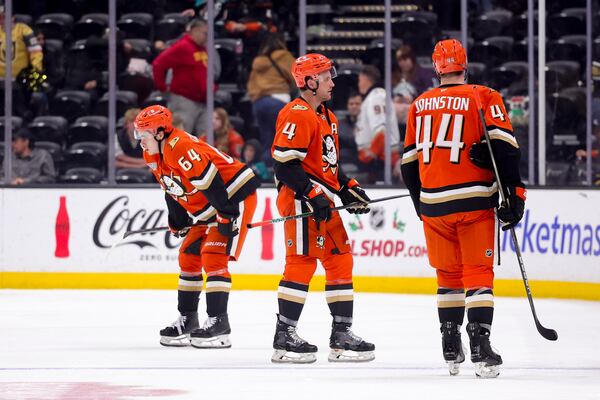 From left, Anaheim Ducks right wing Sam Colangelo, defenseman Cam Fowler, and left wing Ross Johnston skate after the team's loss to the Vegas Golden Knights during an NHL hockey game Wednesday, Dec. 4, 2024, in Anaheim, Calif. (AP Photo/Ryan Sun)