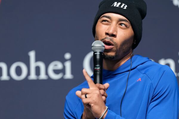 Los Angeles Dodgers right fielder Mookie Betts speaks during a sponsor's promotional event in Tokyo, Tuesday, Jan. 21, 2025. (AP Photo/Eugene Hoshiko)