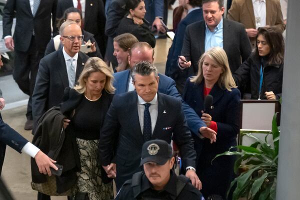 Pete Hegseth, President-elect Donald Trump's nominee to be defense secretary, in black tie, walks through the basement of the Capitol, Wednesday, Dec. 4, 2024, in Washington. (AP Photo/Mark Schiefelbein)