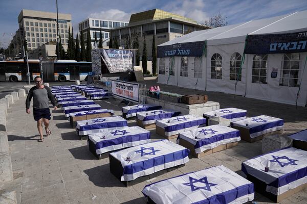 Symbolic coffins are displayed in Jerusalem to protest a hostage deal as Israel's security cabinet is set to convene to decide whether to approve a deal that would release dozens of hostages held by militants in Gaza and pause the 15-month-war, Friday, Jan. 17, 2025. (AP Photo/Mahmoud Illean)