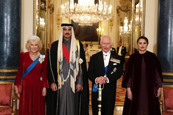 Britain's King Charles III, second right, and Queen Camilla, left, with the Emir of Qatar Sheikh Tamim bin Hamad Al Thani and his wife Sheikha Jawaher ahead of a state banquet at Buckingham Palace, in London, Tuesday, Dec. 3, 2024, during his state visit to the U.K. (Aaron Chown/Pool Photo via AP)