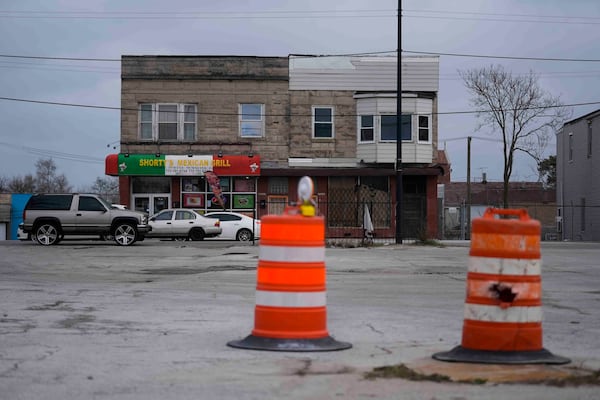 Buildings across from an empty lot where the Chicago Transit Authority plans to expand the Red Line train route sit along South Michigan Avenue, Wednesday, Dec. 11, 2024, in the Roseland neighborhood of Chicago. (AP Photo/Erin Hooley)