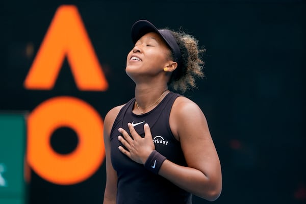 Naomi Osaka of Japan reacts after defeating Karolina Muchova of the Czech Republic in their second round match at the Australian Open tennis championship in Melbourne, Australia, Wednesday, Jan. 15, 2025. (AP Photo/Asanka Brendon Ratnayake)