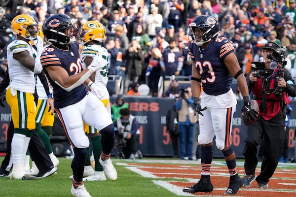 Chicago Bears' Roschon Johnson celebrates his touchdown run during the first half of an NFL football game against the Green Bay Packers Sunday, Nov. 17, 2024, in Chicago. (AP Photo/Nam Y. Huh)