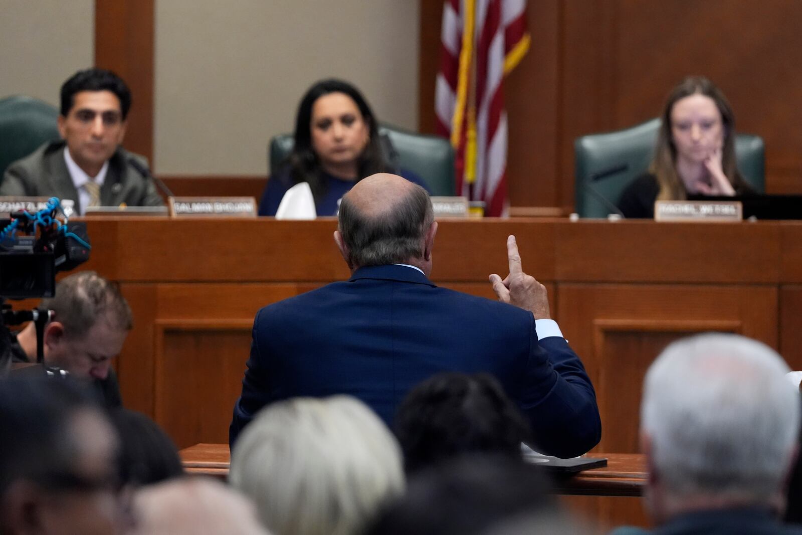 Dr. Phil McGraws, in blue suit gesturing with hand, makes comments during a committee hearing in the case of death row inmate Robert Roberson, Monday, Oct. 21, 2024, in Austin, Texas. (AP Photo/Tony Gutierrez)