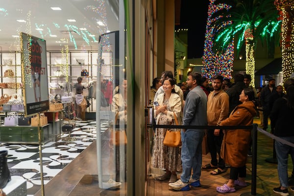 Early Black Friday shoppers line up outside stores at Citadel Outlets in Commerce, Calif., Thursday, Nov. 28, 2024. (AP Photo/Jae C. Hong)