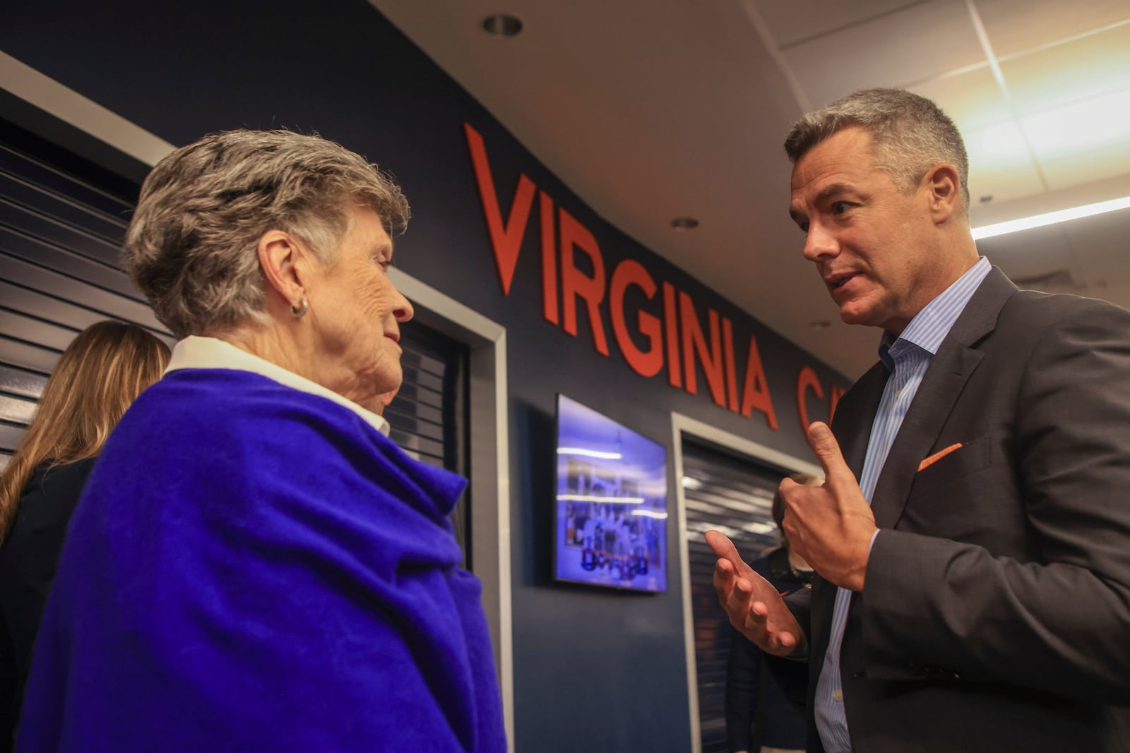 Pat Parkhill speaks with Virginia NCAA college basketball coach Tony Bennett after Bennett announced his retirement in Charlottesville, Va., Friday, Oct. 18, 2024. (Cal Cary/The Daily Progress via AP)