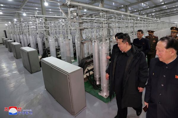 In this undated photo provided Wednesday, Jan. 29, 2025, by the North Korean government, its leader Kim Jong Un, front, second right, inspects a facility that produces nuclear material at an undisclosed location in North Korea. Independent journalists were not given access to cover the event depicted in this image distributed by the North Korean government. The content of this image is as provided and cannot be independently verified. Korean language watermark on image as provided by source reads: "KCNA" which is the abbreviation for Korean Central News Agency. (Korean Central News Agency/Korea News Service via AP)