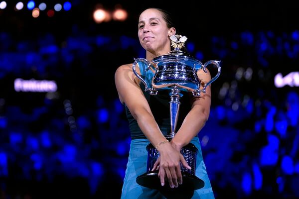 Madison Keys of the U.S. holds the Daphne Akhurst Memorial Cup after defeating Aryna Sabalenka of Belarus in the women's singles final at the Australian Open tennis championship in Melbourne, Australia, Saturday, Jan. 25, 2025. (AP Photo/Asanka Brendon Ratnayake)