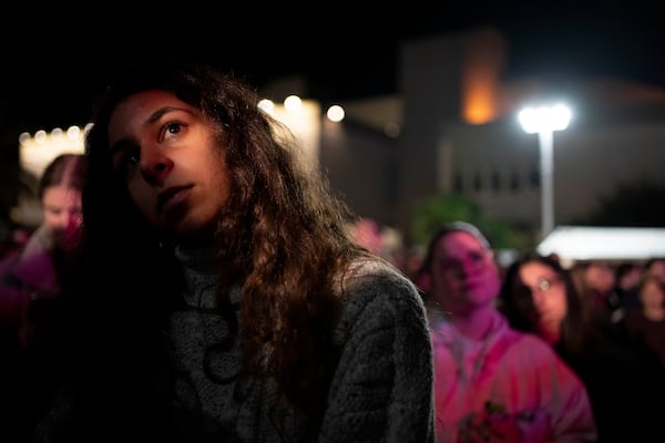 People gather for a rally to free hostages held by Hamas militants in the Gaza Strip, in Tel Aviv, Israel, Tuesday, Jan. 14, 2025. (AP Photo/Maya Alleruzzo)