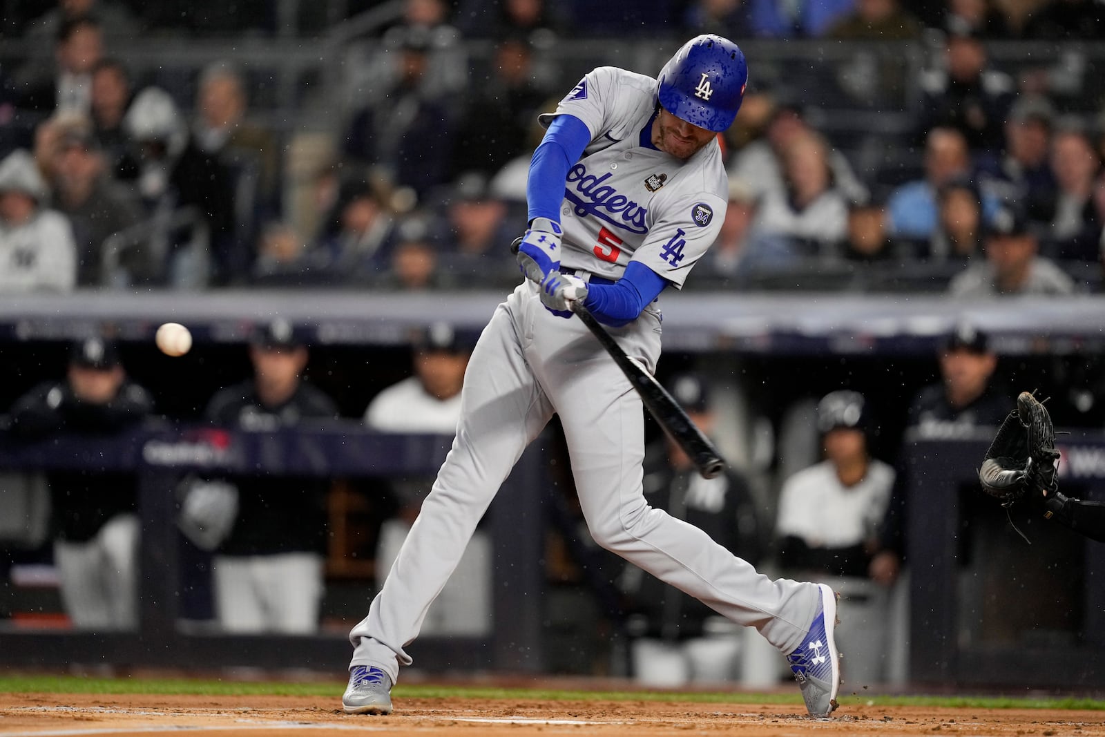 Los Angeles Dodgers' Freddie Freeman hits a two-run home run against the New York Yankees during the first inning in Game 4 of the baseball World Series, Tuesday, Oct. 29, 2024, in New York. (AP Photo/Ashley Landis)