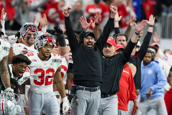 Ohio State head coach Ryan Day and staff celebrate a field goal by place kicker Jayden Fielding during the second half of the College Football Playoff national championship game against Notre Dame, Monday, Jan. 20, 2025, in Atlanta. (Jason Getz/Atlanta Journal-Constitution via AP)