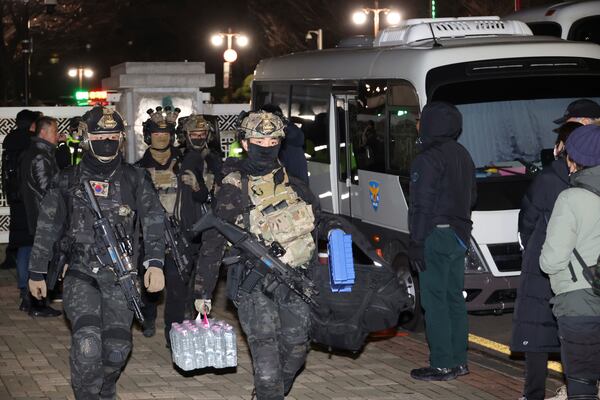 South Korean martial law soldiers leave the National Assembly in Seoul, South Korea, Wednesday, Dec. 4, 2024. (Kim Ju-sung/Yonhap via AP)