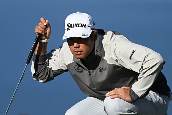 Hideki Matsuyama lines up a putt on the tenth hole of the North Course at Torrey Pines during the second round of the Farmers Insurance Open golf tournament Thursday, Jan. 23, 2025, in San Diego. (AP Photo/Denis Poroy)