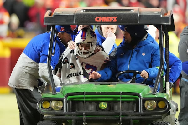 Buffalo Bills cornerback Christian Benford is assisted after being injured during the first half of the AFC Championship NFL football game against the Kansas City Chiefs, Sunday, Jan. 26, 2025, in Kansas City, Mo. (AP Photo/Charlie Riedel)