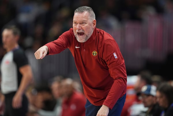 Denver Nuggets head coach Michael Malone directs his players against the Oklahoma City Thunder in the second half of an NBA basketball game Wednesday, Nov. 6, 2024, in Denver. (AP Photo/David Zalubowski)