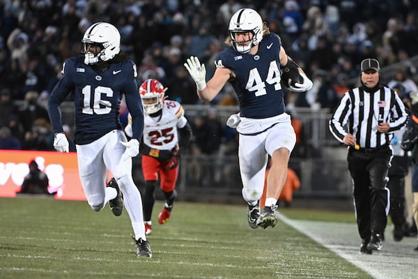 Penn State tight end Tyler Warren (44) gains yardage against Maryland during the second quarter of an NCAA college football game, Saturday, Nov. 30, 2024, in State College, Pa. (AP Photo/Barry Reeger)